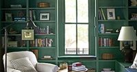 Ashley painted the study's walls, trim, and ceiling with Farrow & Ball's Green Smoke to give the room a cozy, "cavelike" atmosphere.