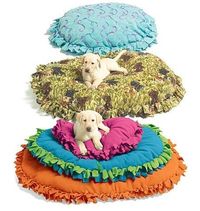 DIY pet bed... so really you just fold a blanket in half, fringe the edges on every side except the fold, make long enough to closely tie the knots together, stuff with anything you wish. old crib mattress, couch cushion, old pillows... my gosh this doesn...